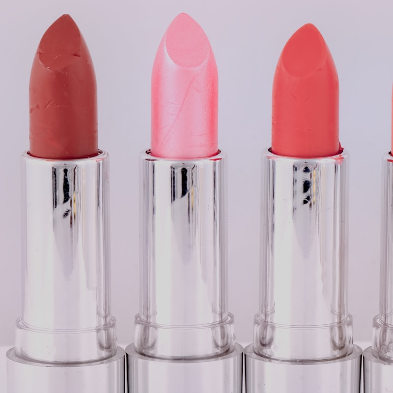A row of pink and nude lipsticks