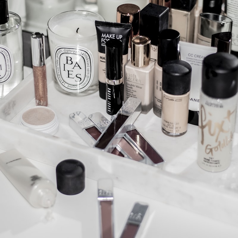 Skincare and makeup arranged on a marble vanity
