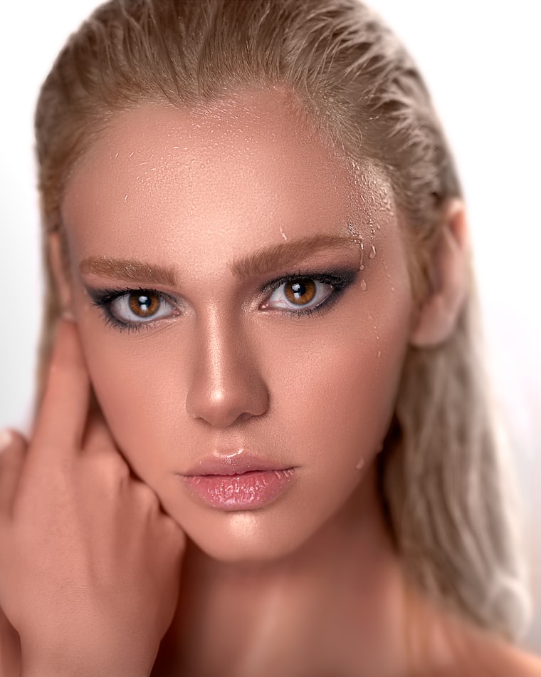 Dewy glass-skin finish with a soft smoky eye