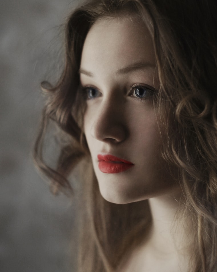 Soft-focus portrait with a classic red lip