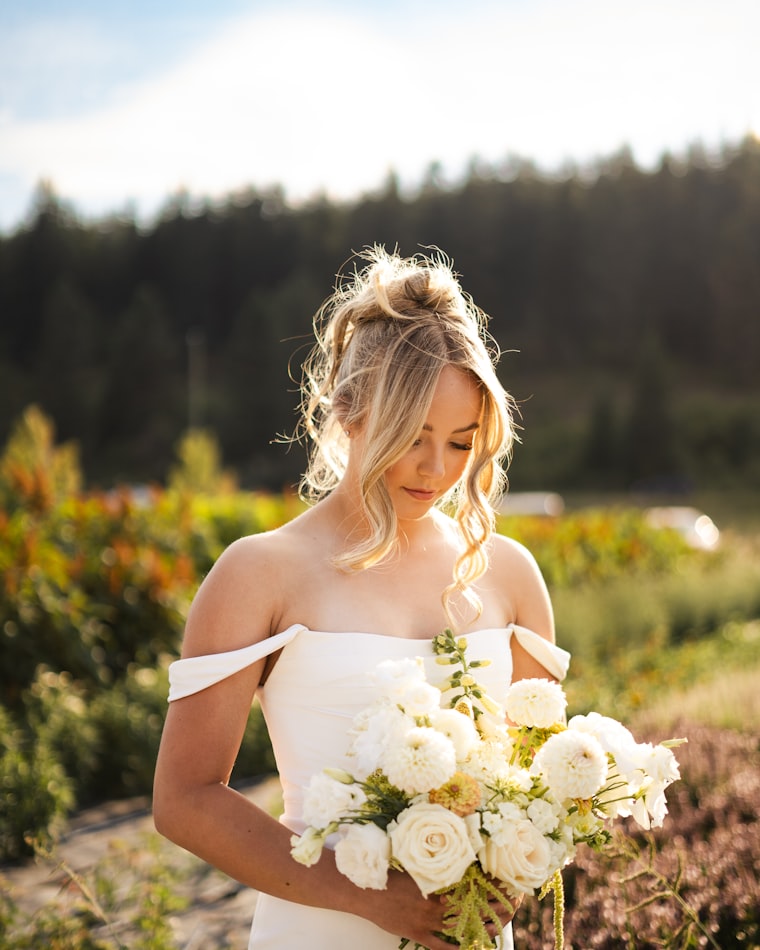 Bride in a white dress holding a bouquet